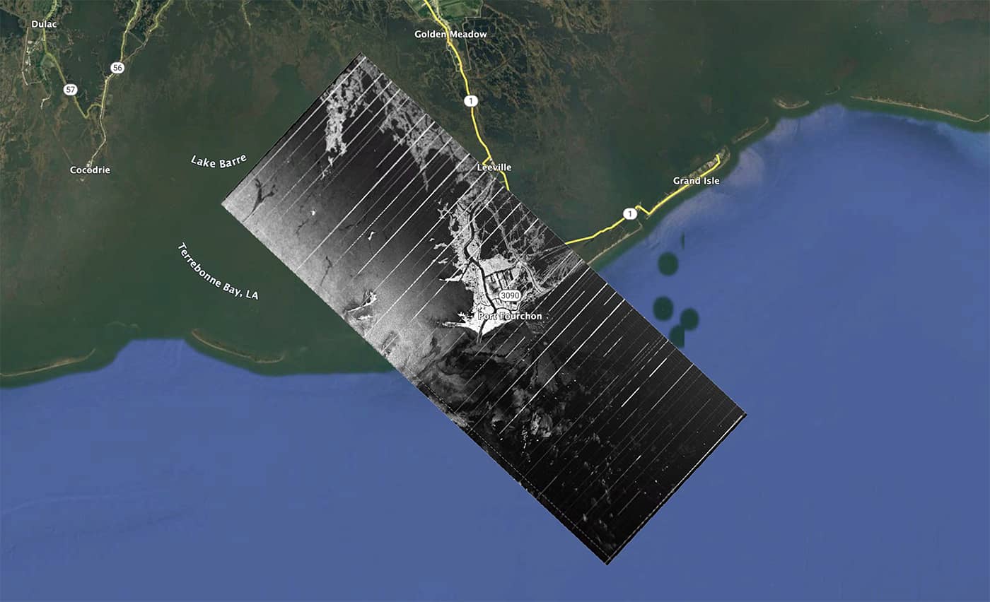 Black and white radar image overlaid on Google Earth satellite imagery