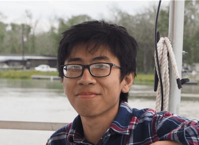 Headshot of Justin Nghiem on a boat