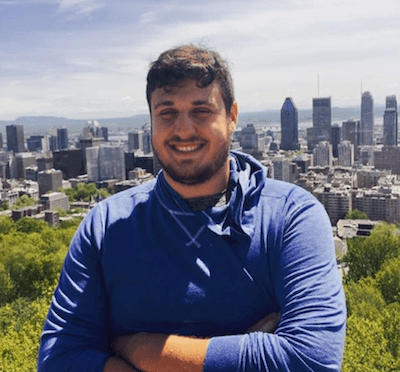 Headshot of Matt Weiser with a city skyline in the background