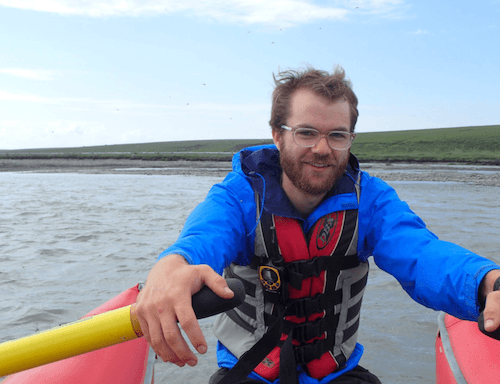 Ted Langhorst rowing a boat in a body of water